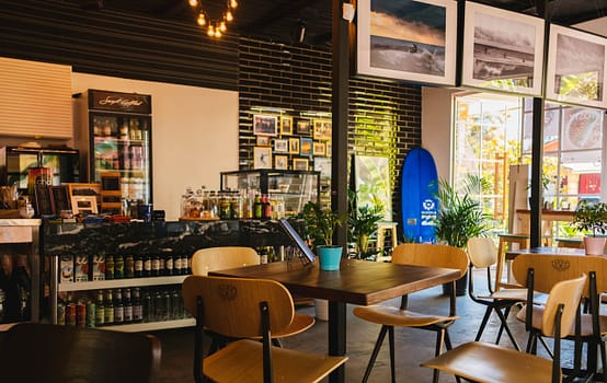 pexels-photo-1307698 Stylish café interior with modern decor and natural lighting, located in Sochi, Russia.